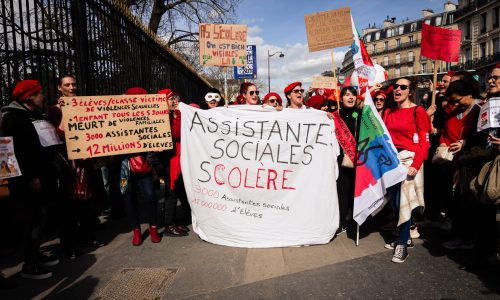 A group of civil services workers seen with a banner that says "Anger of the social workers. The civil service strike took thousands of people to the streets in various demonstrations across France. In Paris, a demonstration of national education workers joined the civil service workers to demand an increase in salaries and to protest against the current French government. - Telmo Pinto / SOPA Images//SOPAIMAGES_SOPA0123/Credit:SOPA Images/SIPA/2403220843